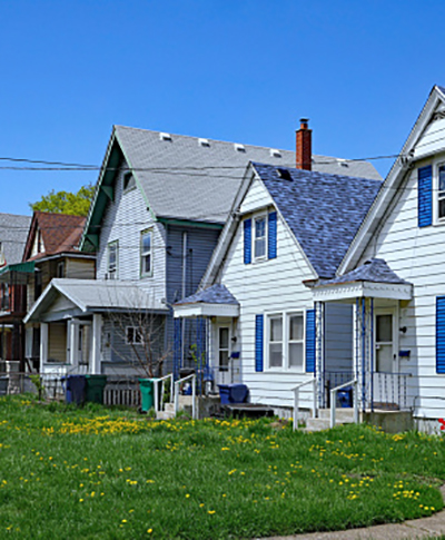 row of small American clapboard houses with gables