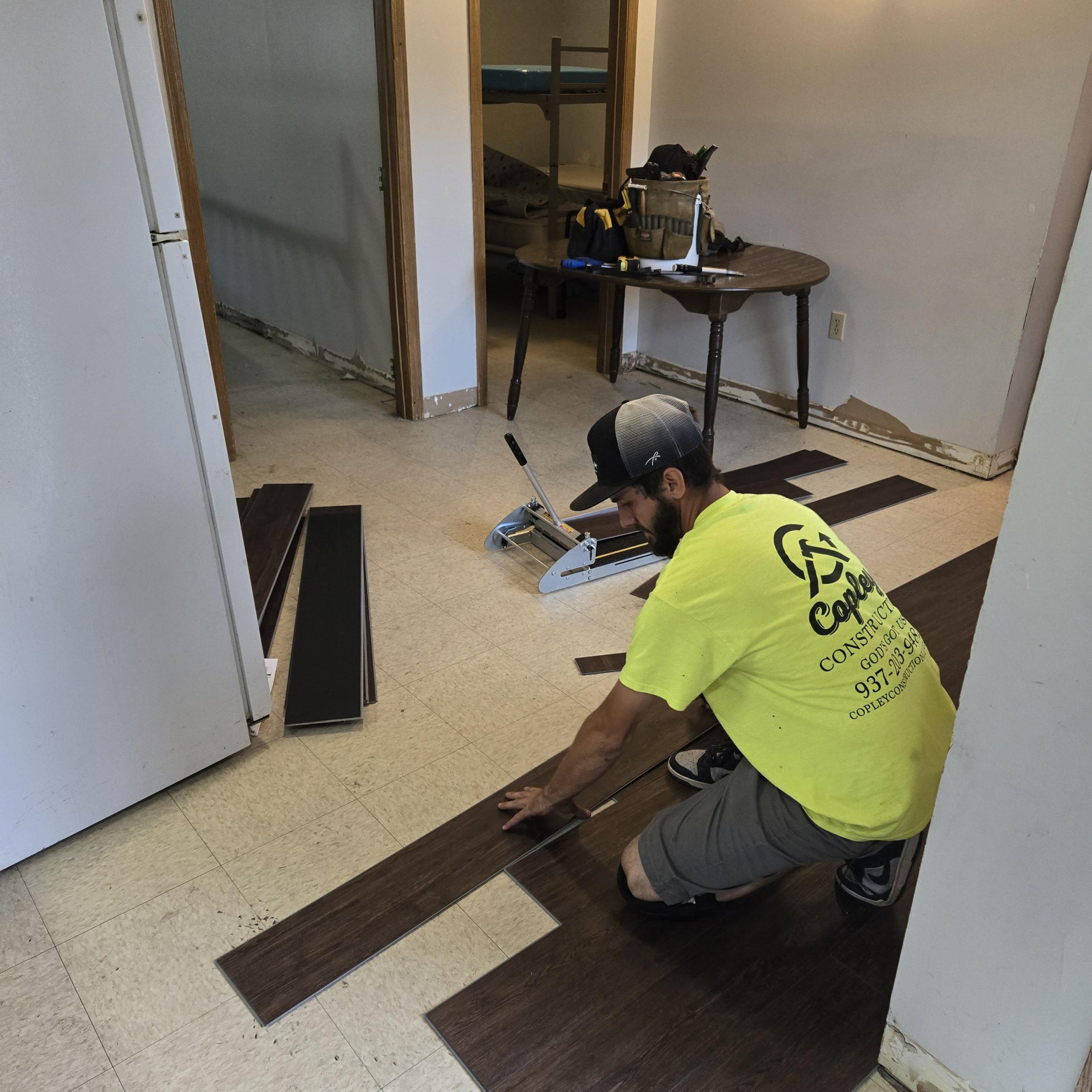 man laying new flooring