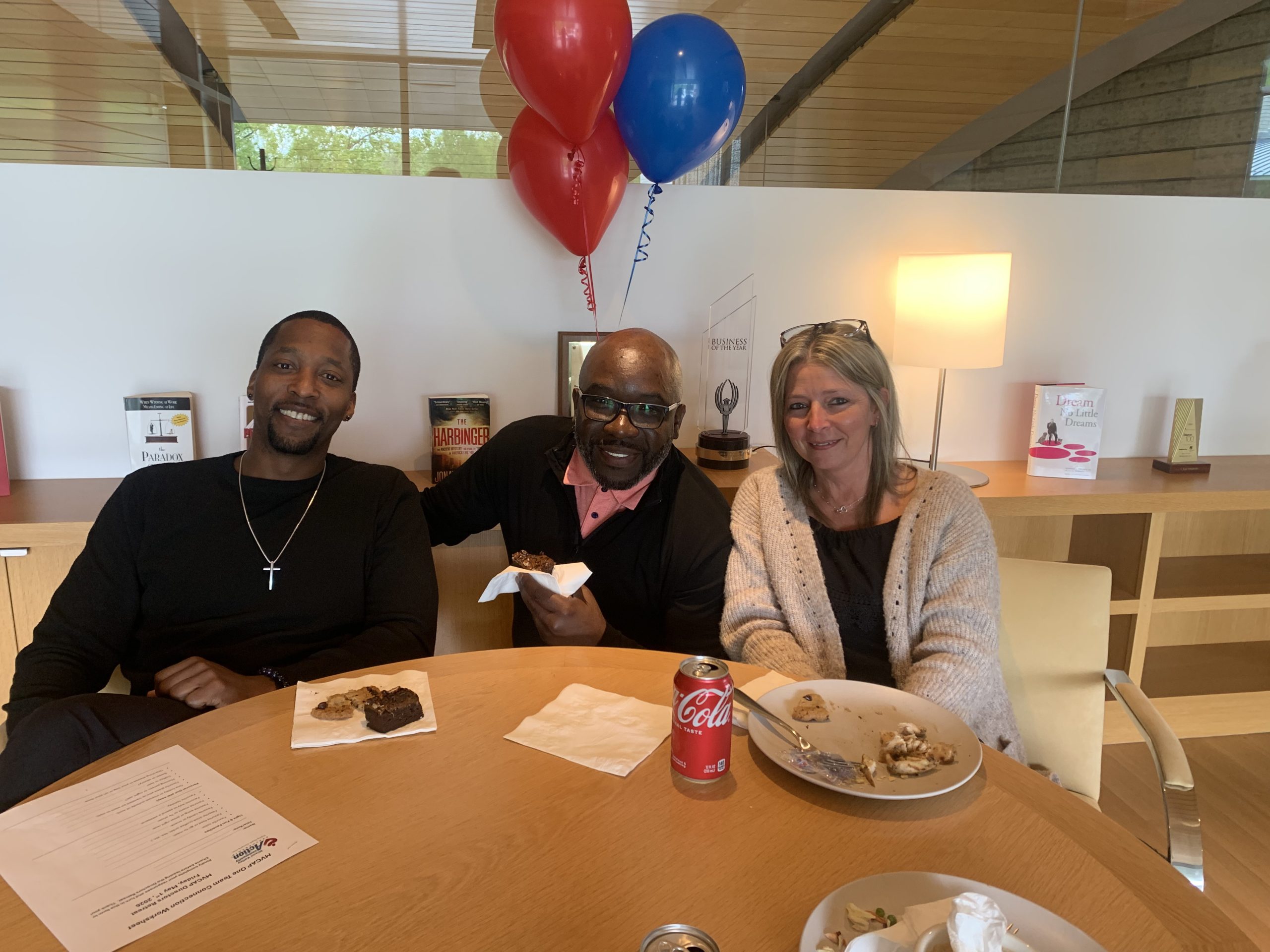 Two men and a woman at lunch