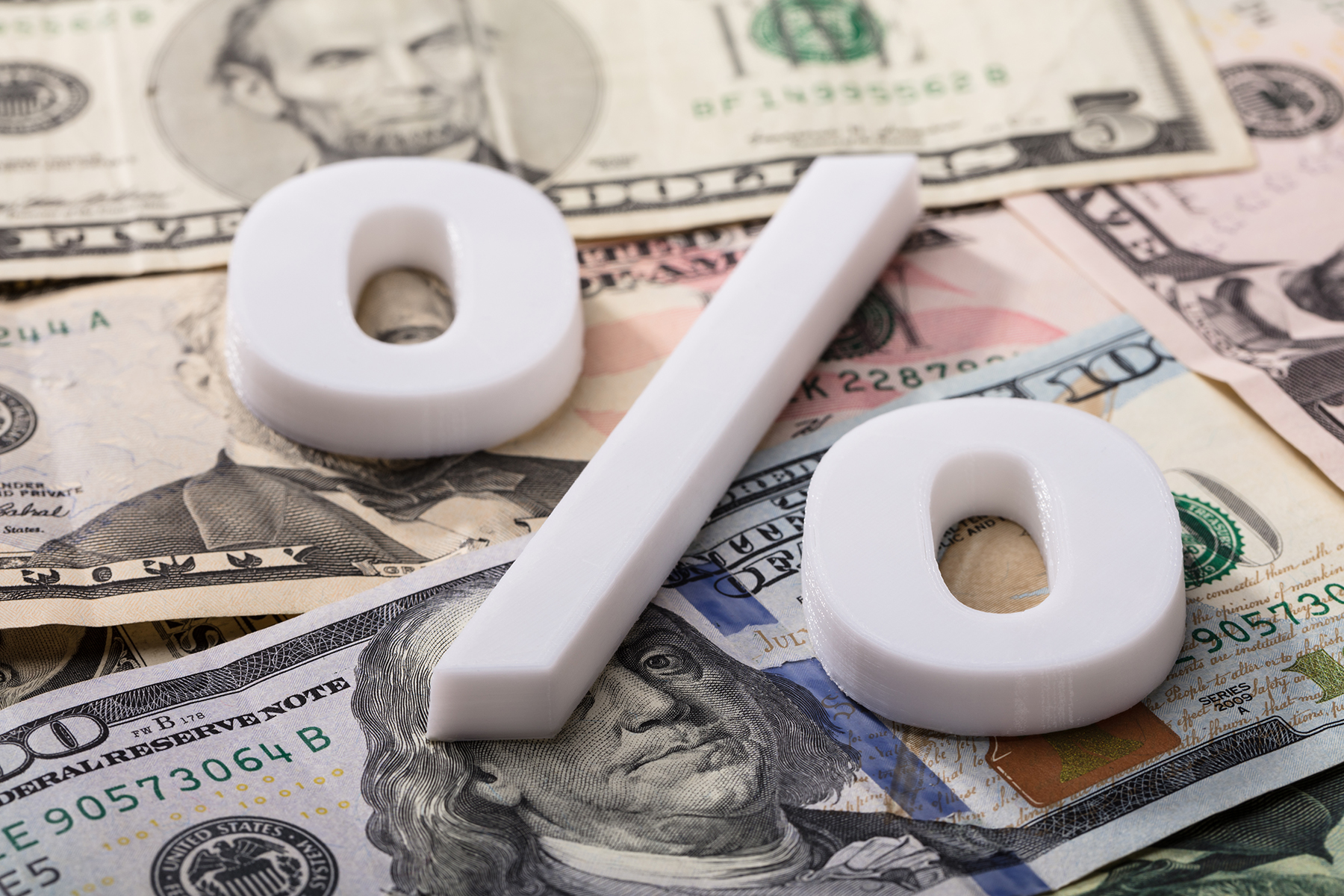 Percent Sign on a Pile of Money